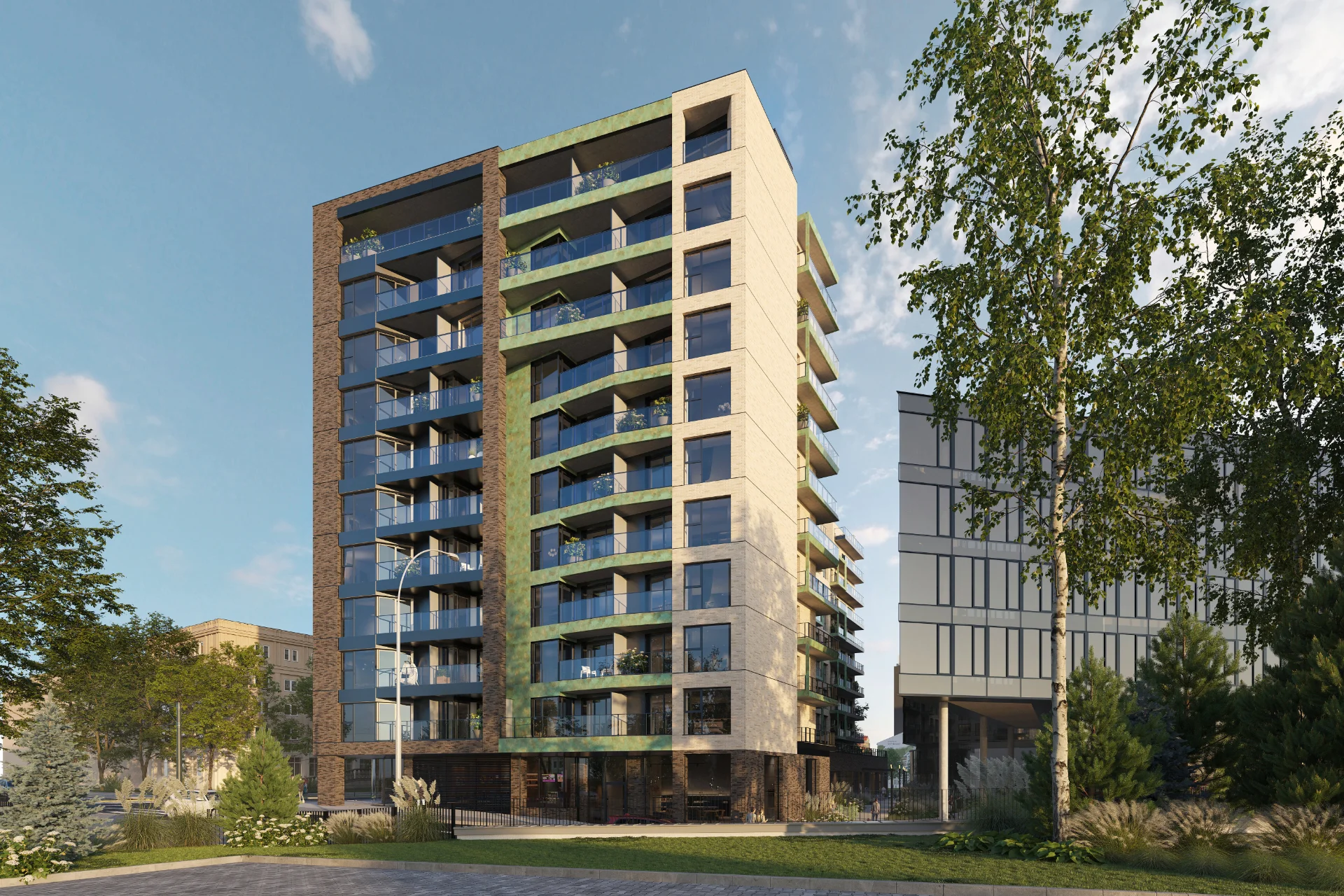 Wieża apartamentowca Mogilska 31 wśród drzew, widok w słoneczny dzień